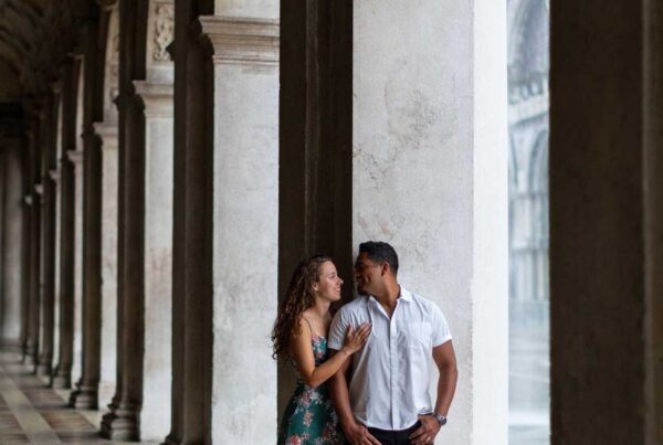 Couple engagement in Venice unde the arches of st. mark square