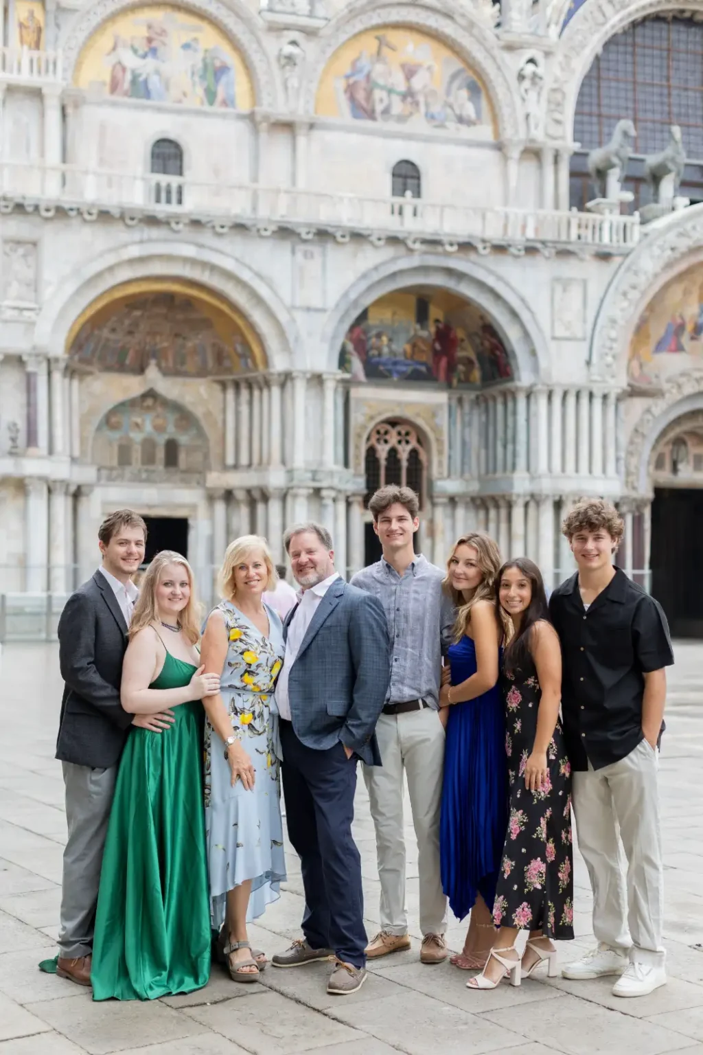 A family of eight photographed together in front of St Mark&rsquo;s Basilica, Venice