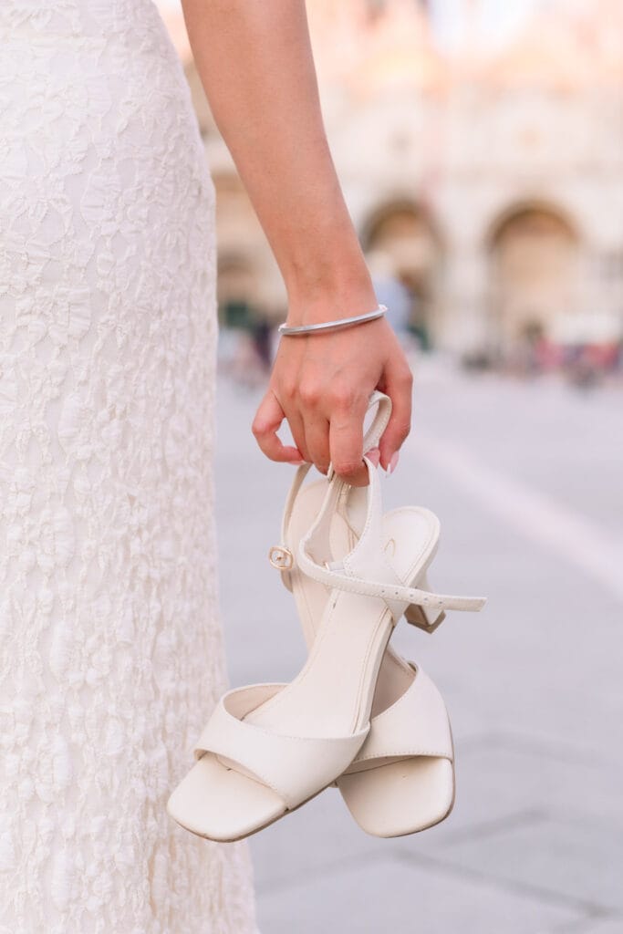 Pair of flat shoes I carry in my backpack during a Venice photo session